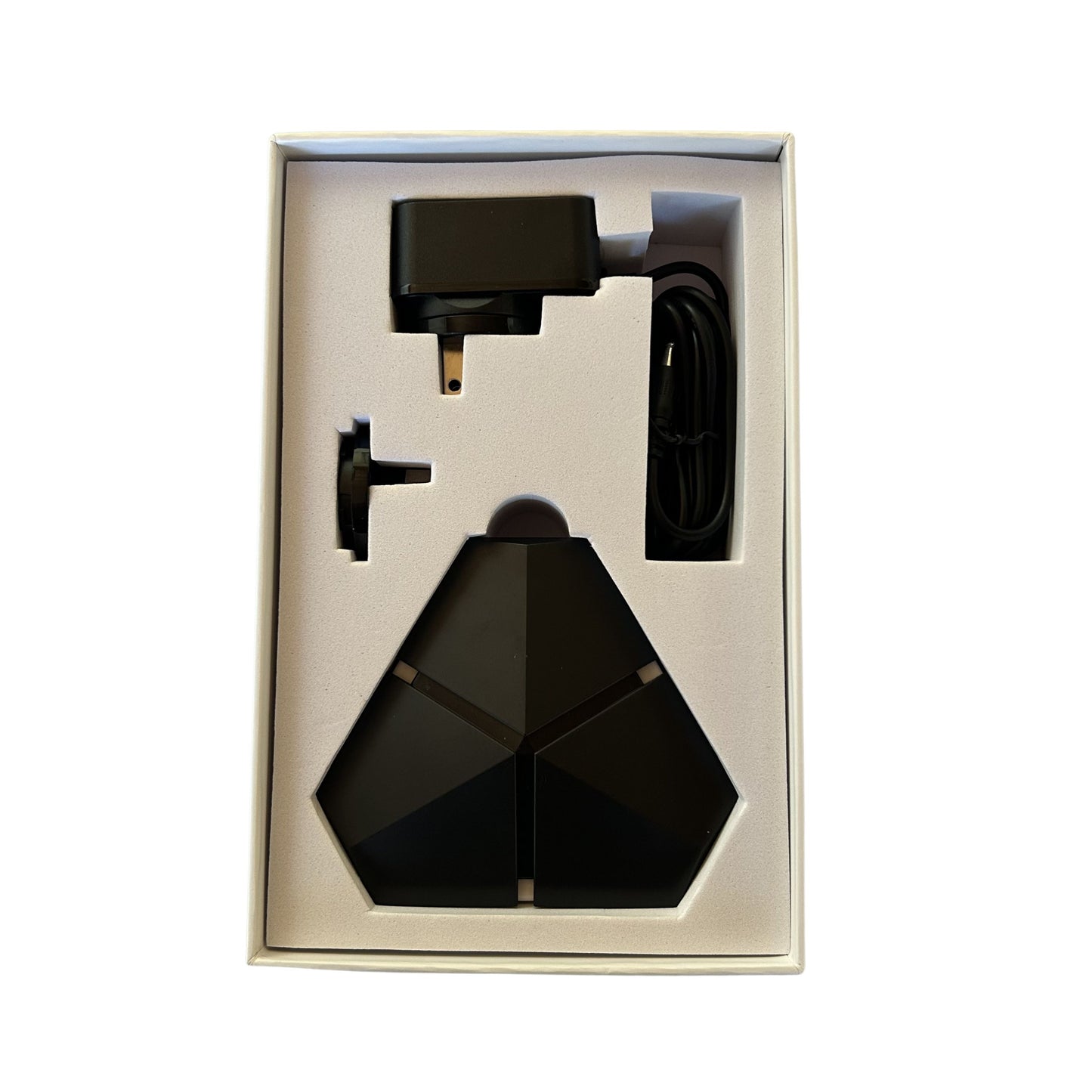 Blushield Phi 03 device with accessories in a box on a white background